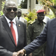 South Sudan's first vice president Riek Machar, left, and President Salva Kiir, right, shake hands following the first meeting of a new transitional coalition government, in the capital Juba, South Sudan, Apr. 29.